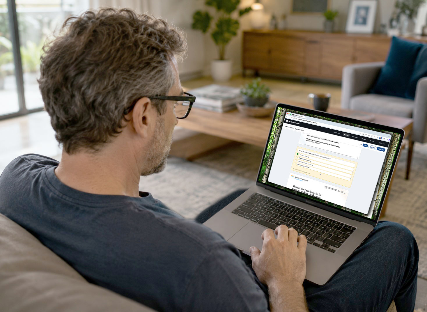 A person sitting on a couch building a quiz on a laptop.